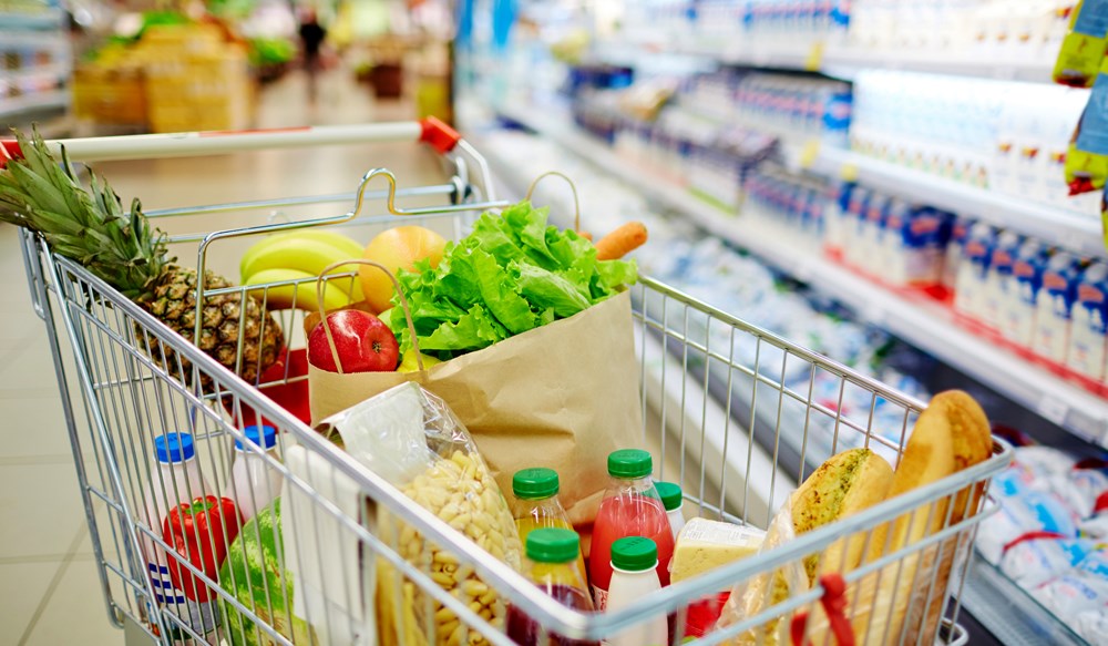 a shopping cart full of groceries